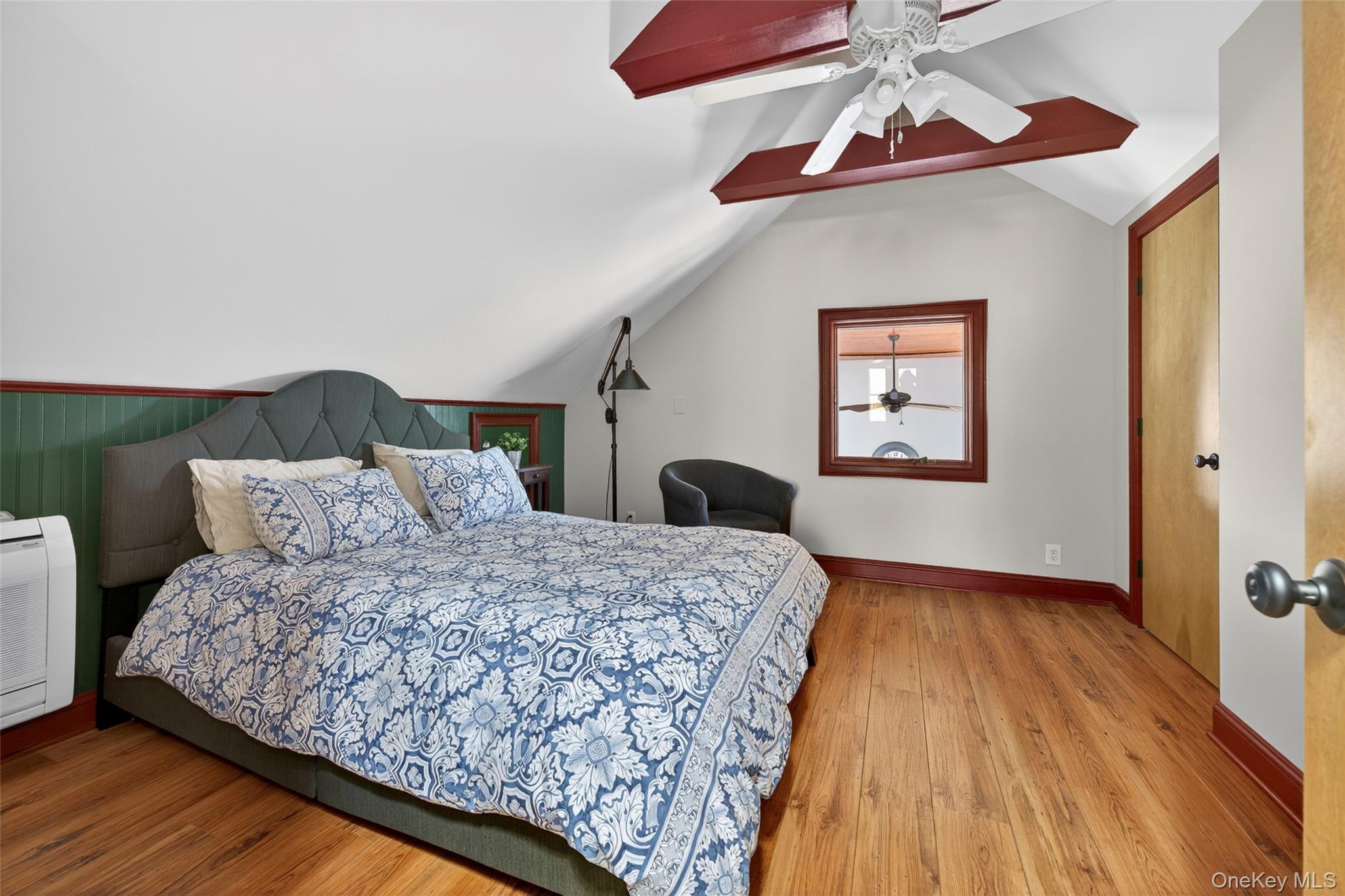 465 Schalck Road Narrowsburg, NY 12764 - Photo 20 of 31 a bedroom with a bed and a chandelier