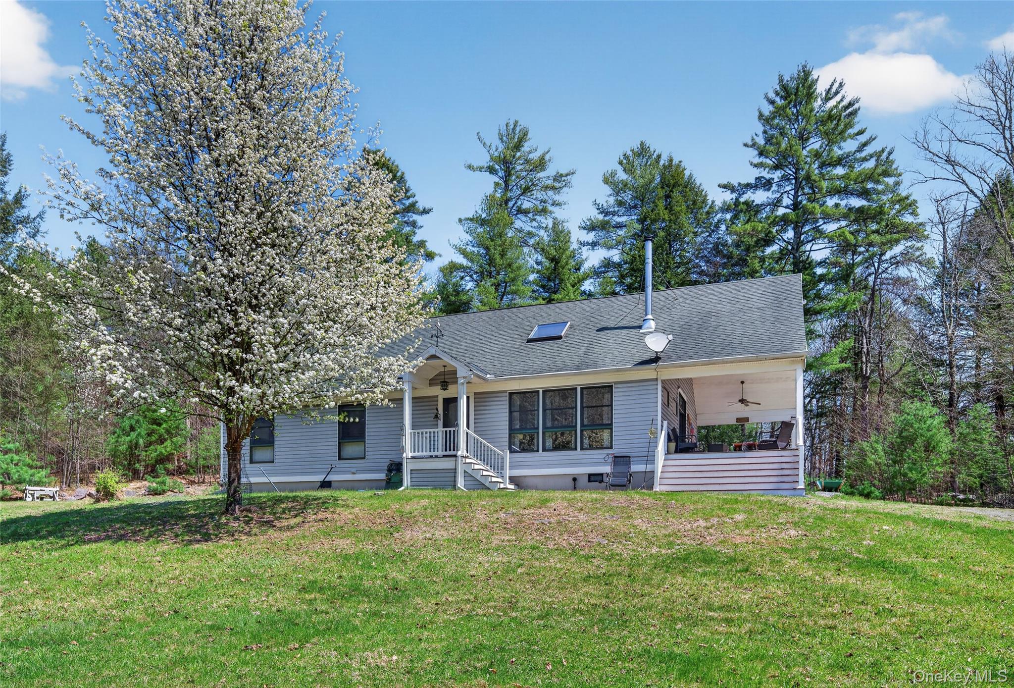 465 Schalck Road Narrowsburg, NY 12764 - Photo 29 of 31 a front view of a house with a garden