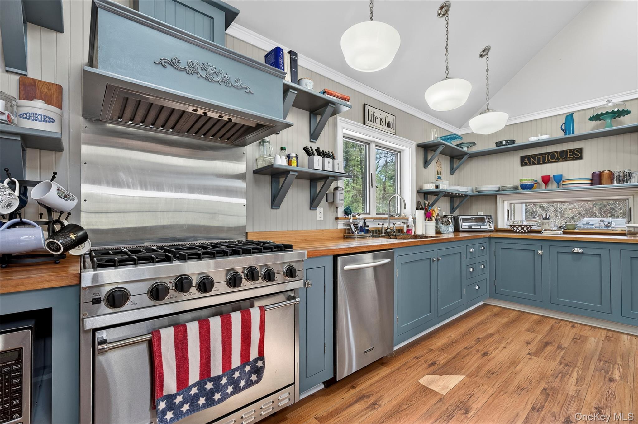 465 Schalck Road Narrowsburg, NY 12764 - Photo 8 of 31 a kitchen with stainless steel appliances granite countertop a stove a sink dishwasher and cabinets with wooden floor