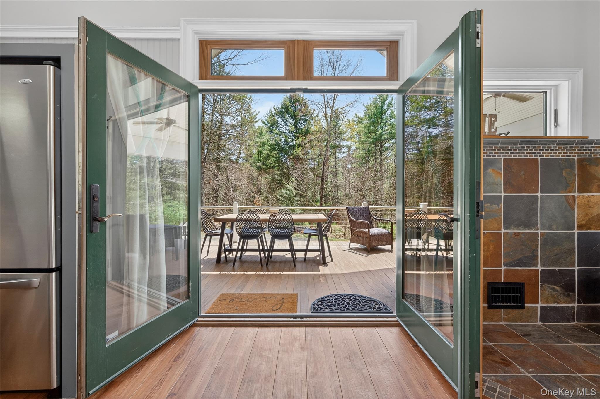 465 Schalck Road Narrowsburg, NY 12764 - Photo 9 of 31 a view of a living room and floor to ceiling window wooden floor