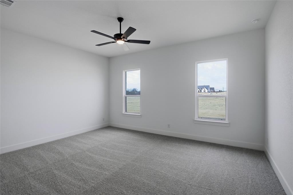 810 Vly Rdg Road Van Alstyne, TX 75495 - Photo 18 of 39 Unfurnished room with carpet floors and a ceiling fan