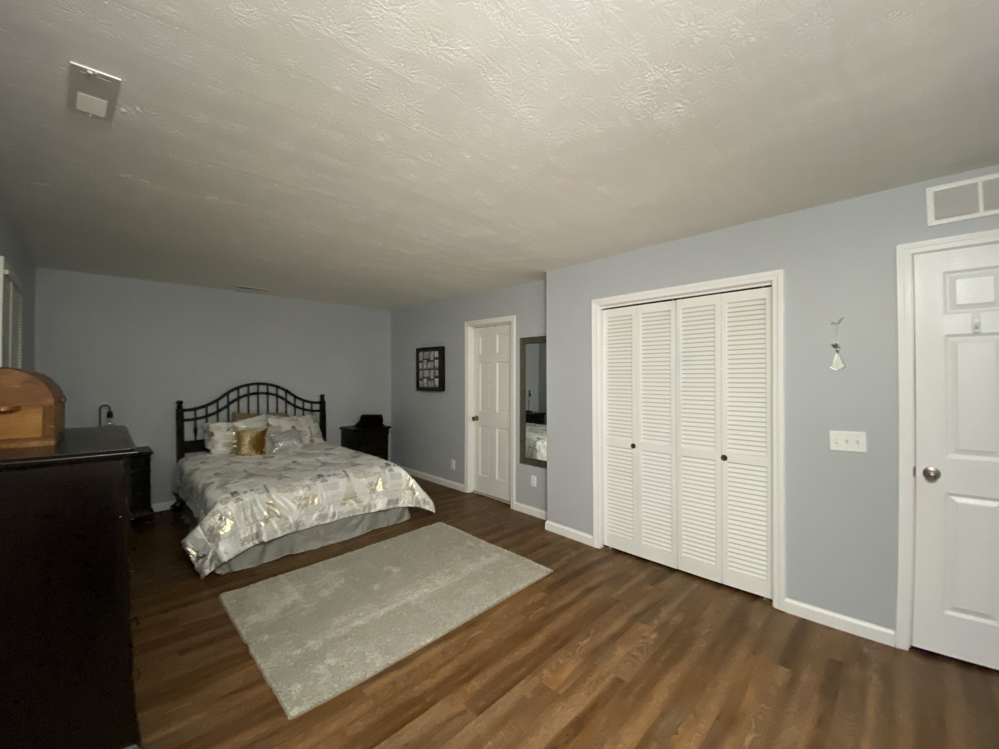4426 Glasgow Road Burkesville, KY 42717 - Photo 12 of 24 a bedroom with a bed and a night stand