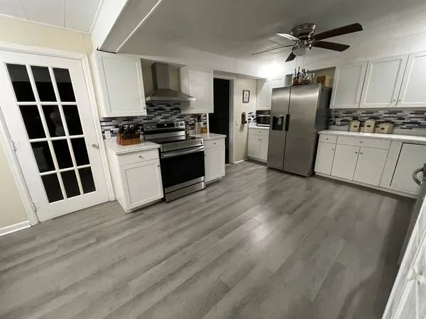 a view of a storage & utility room with cabinets