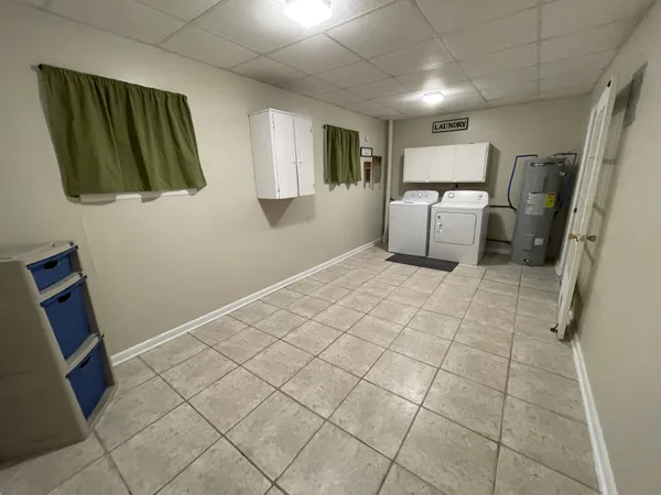 a aerial view of a house with swimming pool and sitting space