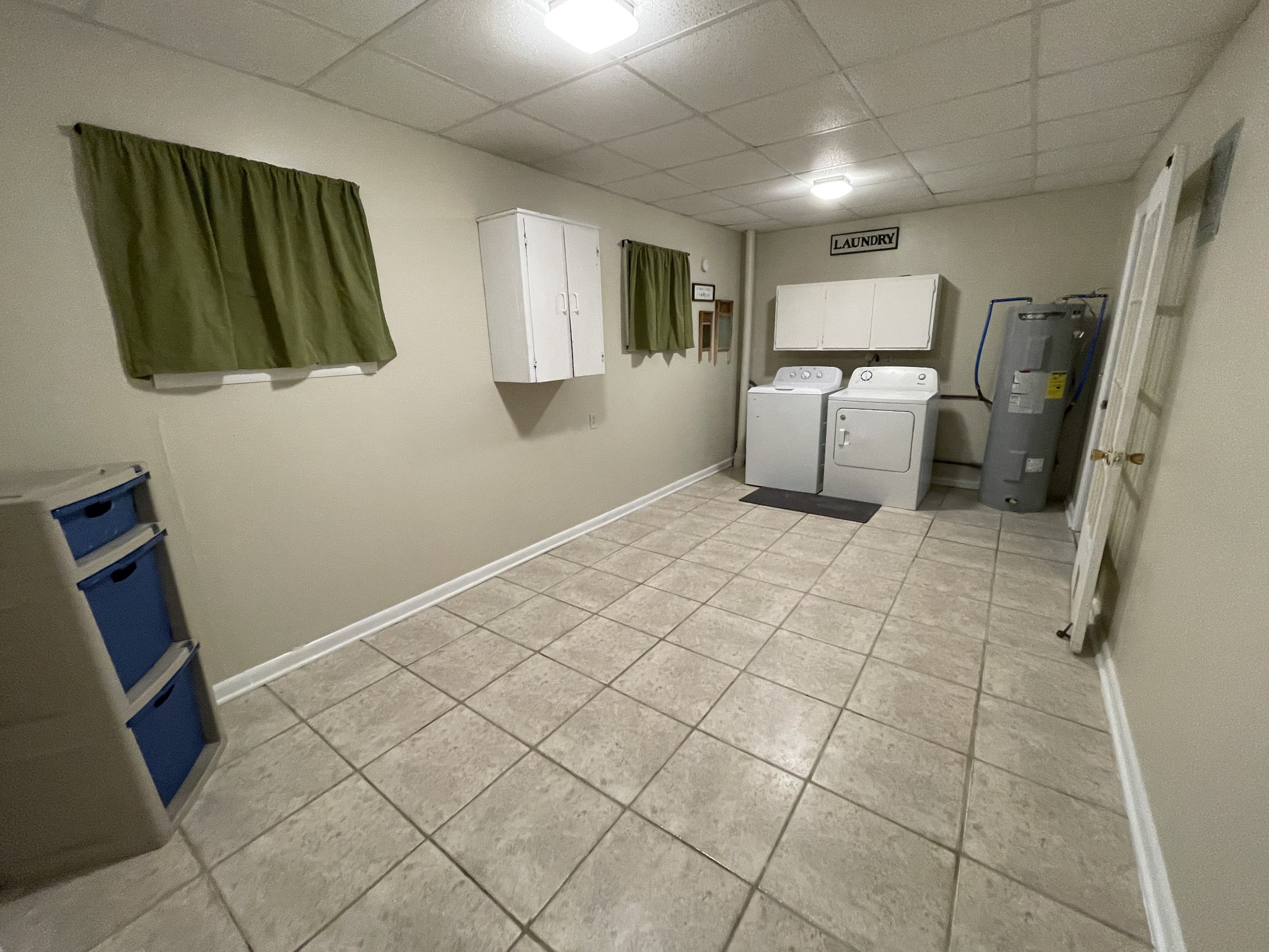 4426 Glasgow Road Burkesville, KY 42717 - Photo 21 of 24 a view of a storage & utility room with cabinets