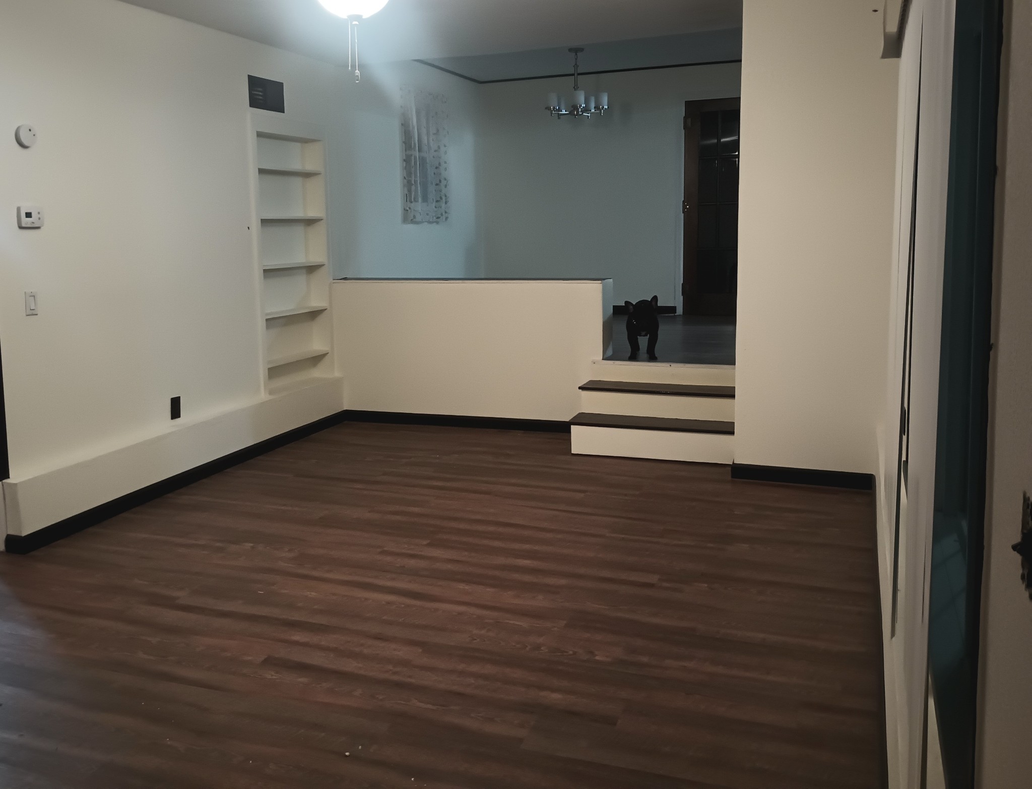 4426 Glasgow Road Burkesville, KY 42717 - Photo 3 of 24 a view of an empty room with wooden floor and closet