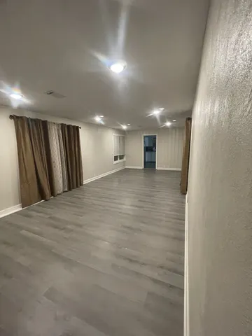 a view of a hallway with a room