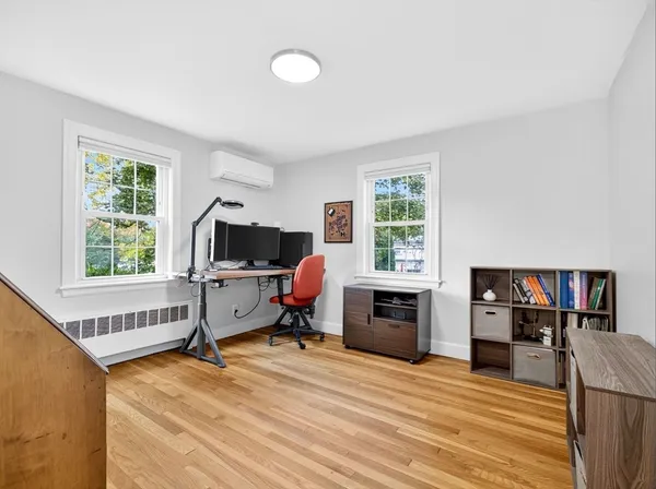 a bedroom with furniture window and a fireplace