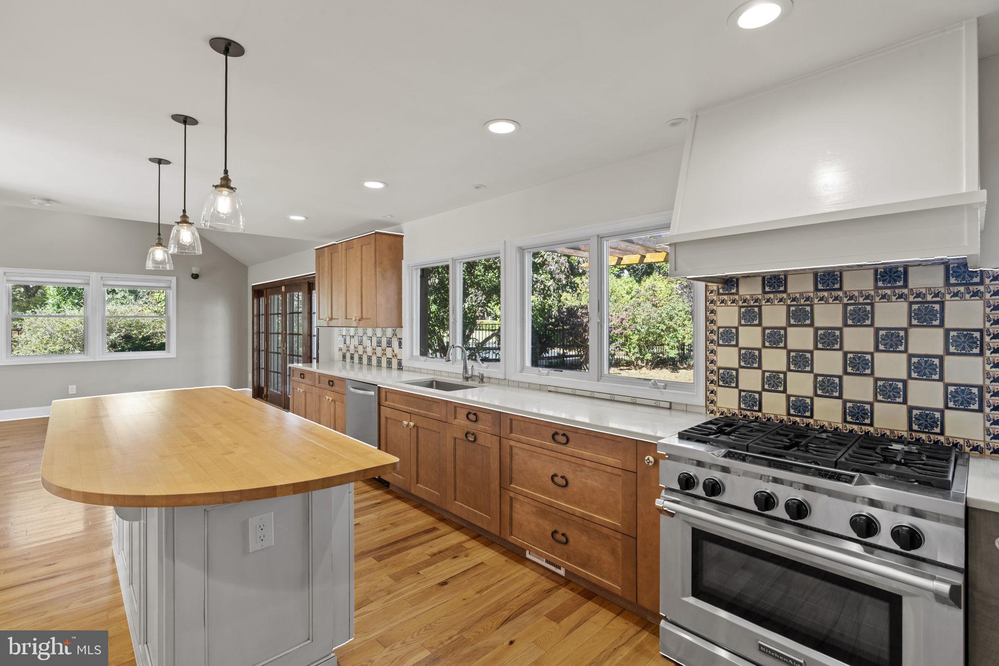 1007 Nicholson Road Wynnewood, PA 19096 - Photo 15 of 29 a kitchen with stainless steel appliances granite countertop a stove a sink and a wooden floors