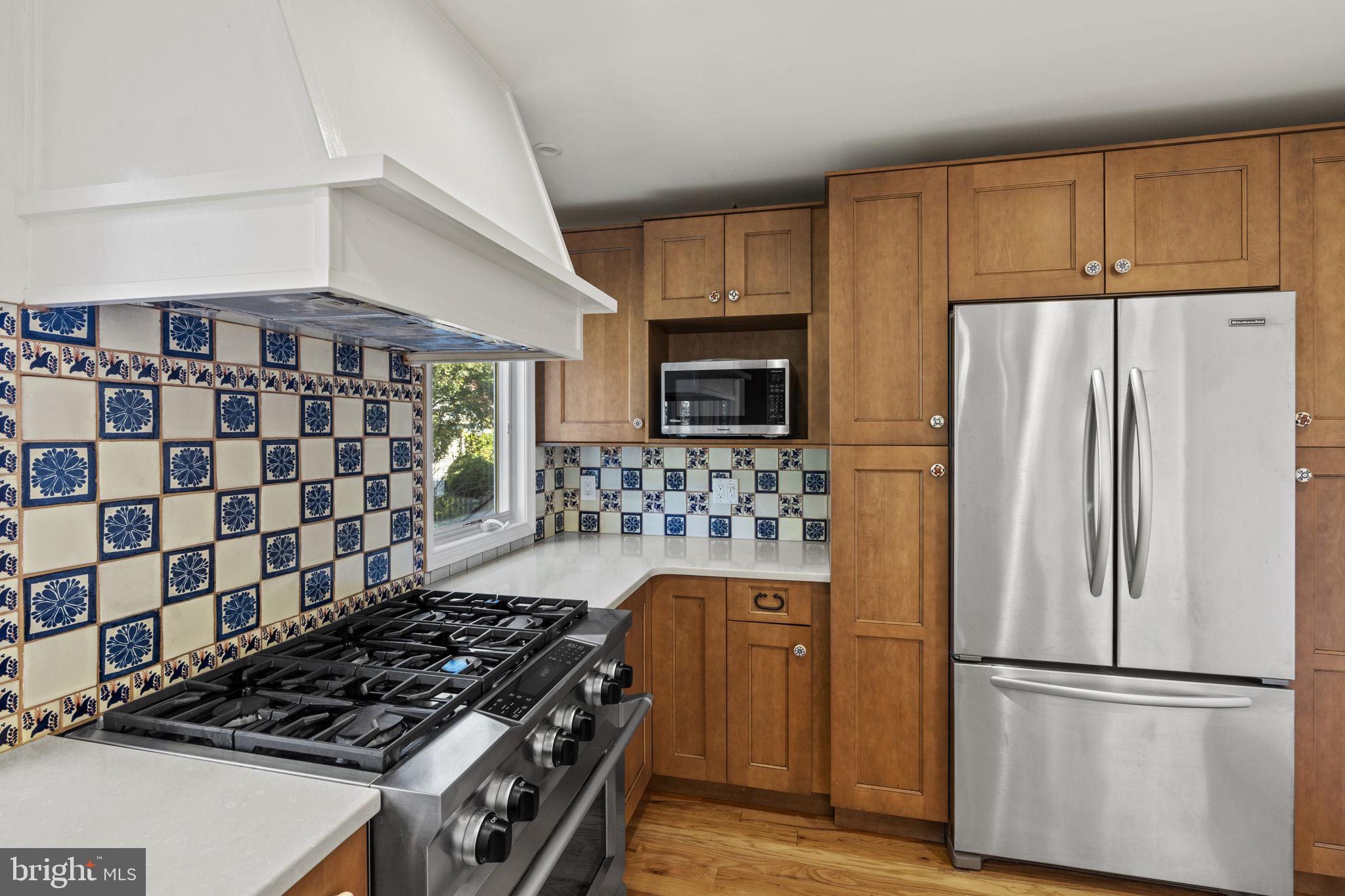 1007 Nicholson Road Wynnewood, PA 19096 - Photo 16 of 29 a kitchen with a refrigerator and a stove