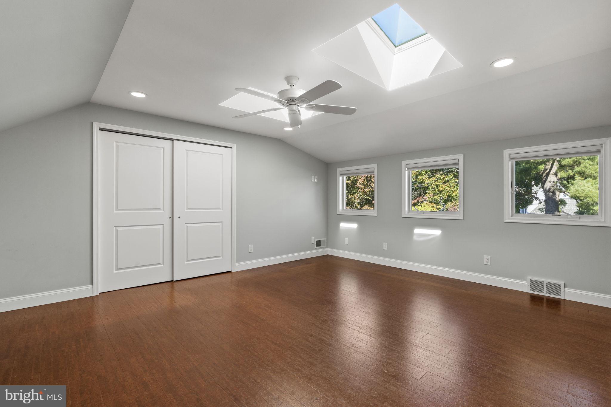 1007 Nicholson Road Wynnewood, PA 19096 - Photo 21 of 29 a view of an empty room with a window and wooden floor
