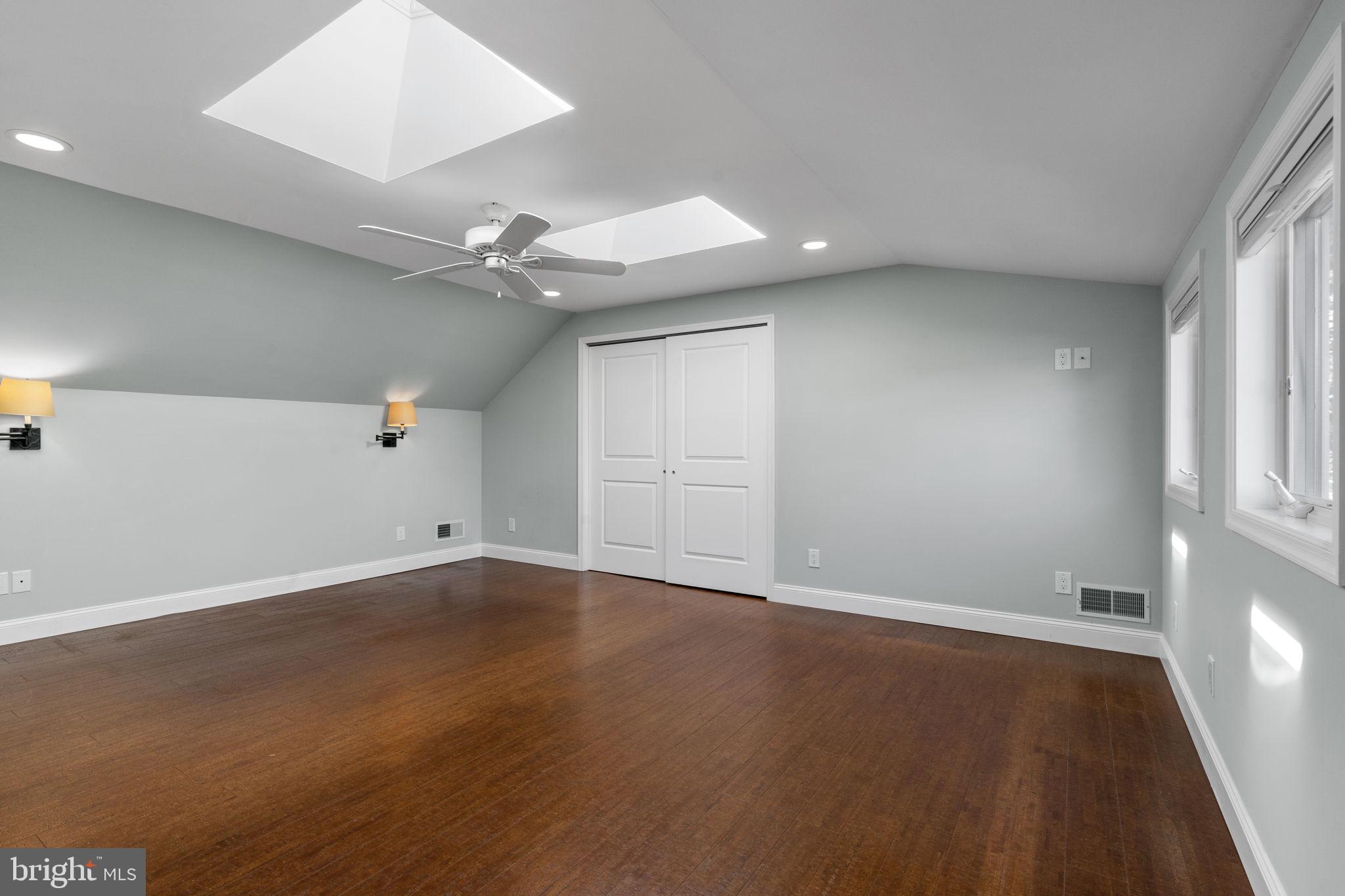1007 Nicholson Road Wynnewood, PA 19096 - Photo 22 of 29 an empty room with wooden floor and ceiling fan