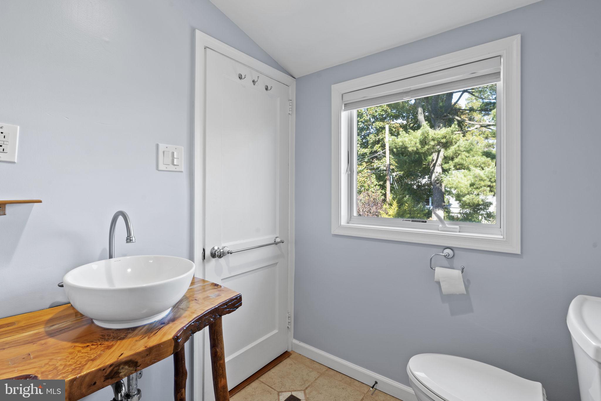 1007 Nicholson Road Wynnewood, PA 19096 - Photo 24 of 29 a bathroom with a toilet sink and mirror
