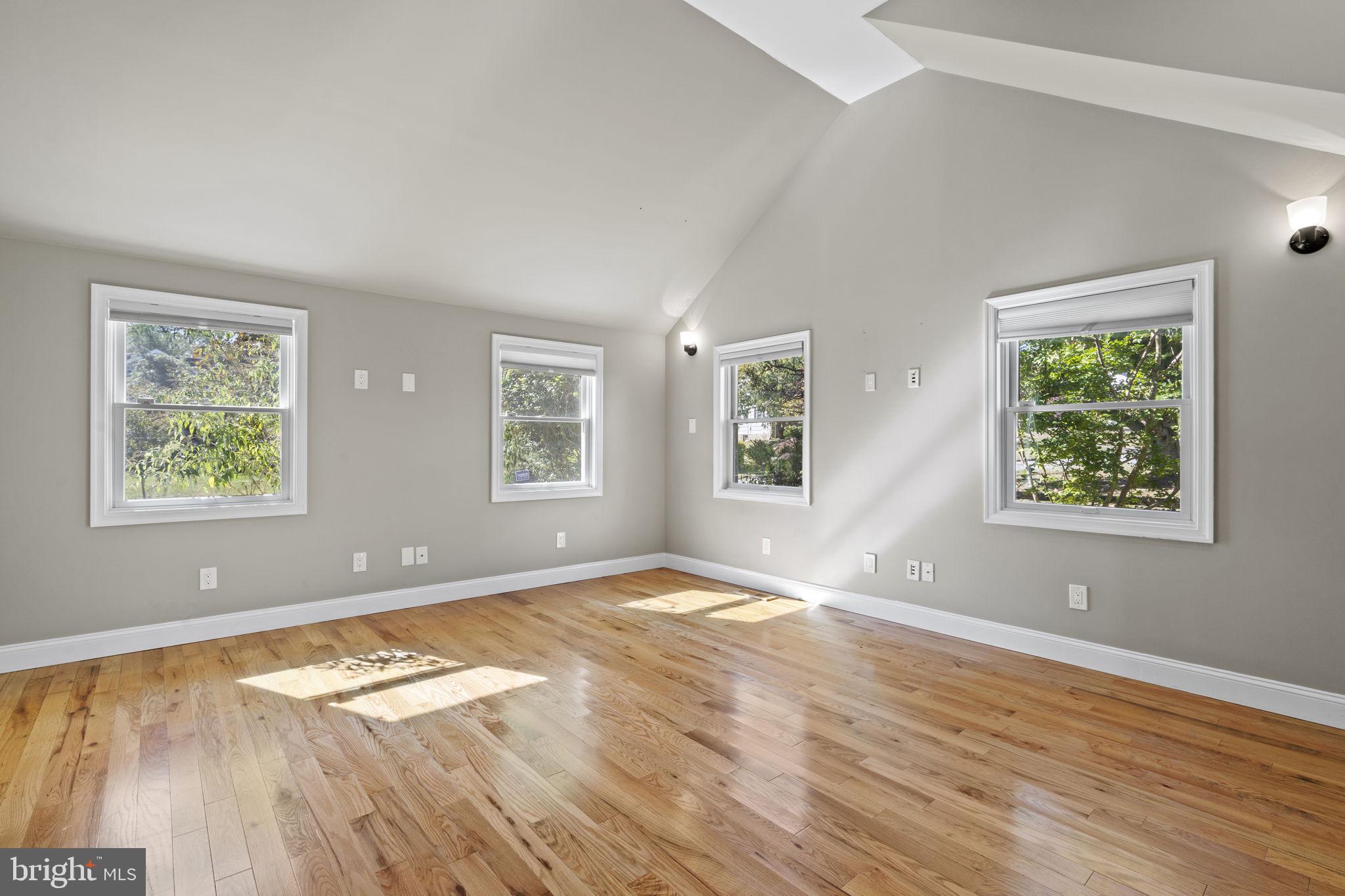 1007 Nicholson Road Wynnewood, PA 19096 - Photo 10 of 29 a view of empty room with wooden floor and fan