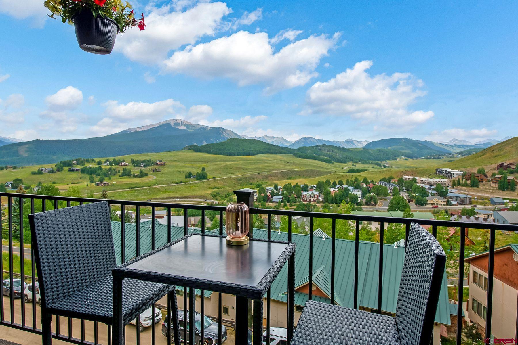 a view of a balcony with lake view and mountain view