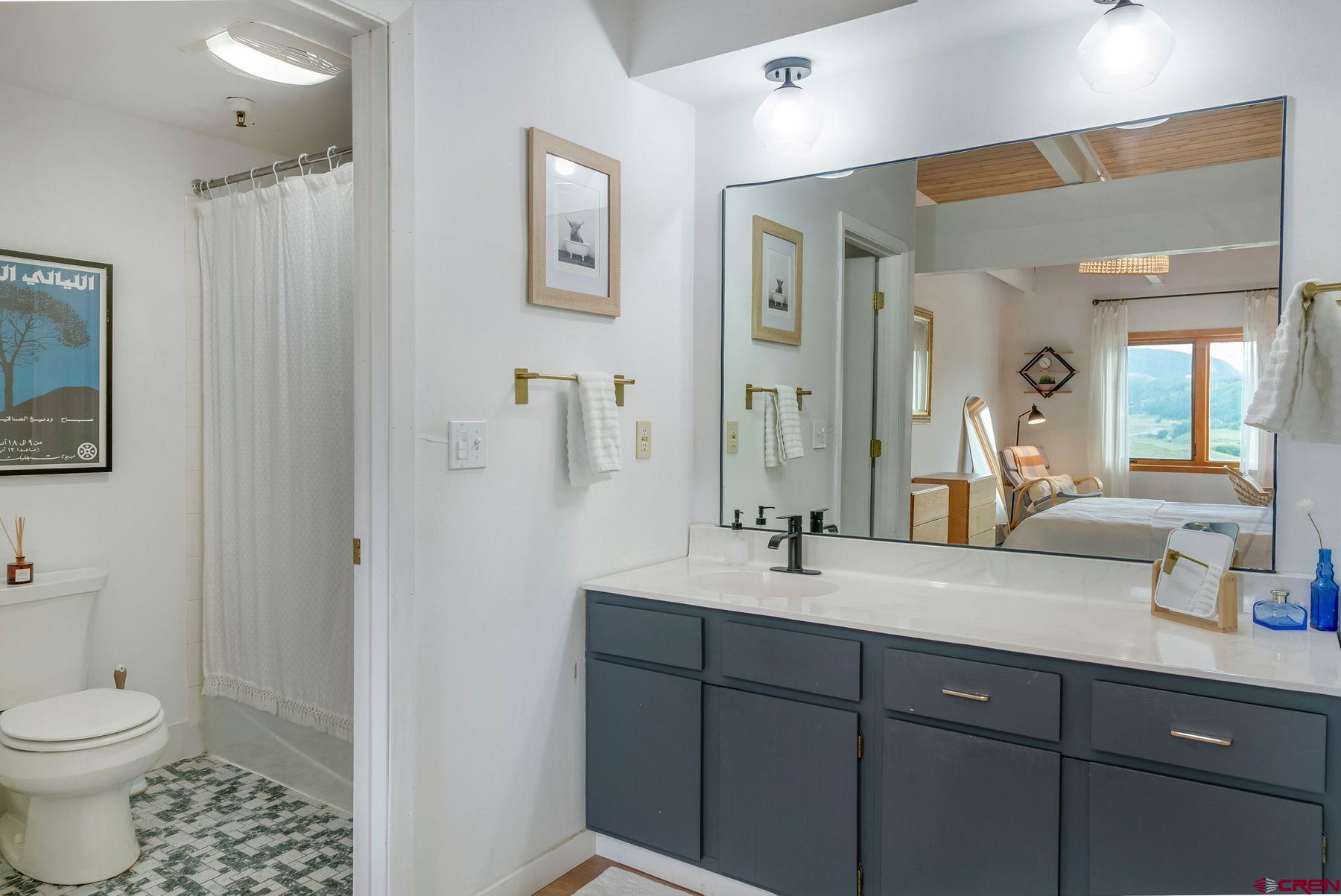 32 Hunter Hill Road, Unit B204 Crested Butte, CO 81225 - Photo 16 of 33 a bathroom with a double vanity sink mirror and toilet