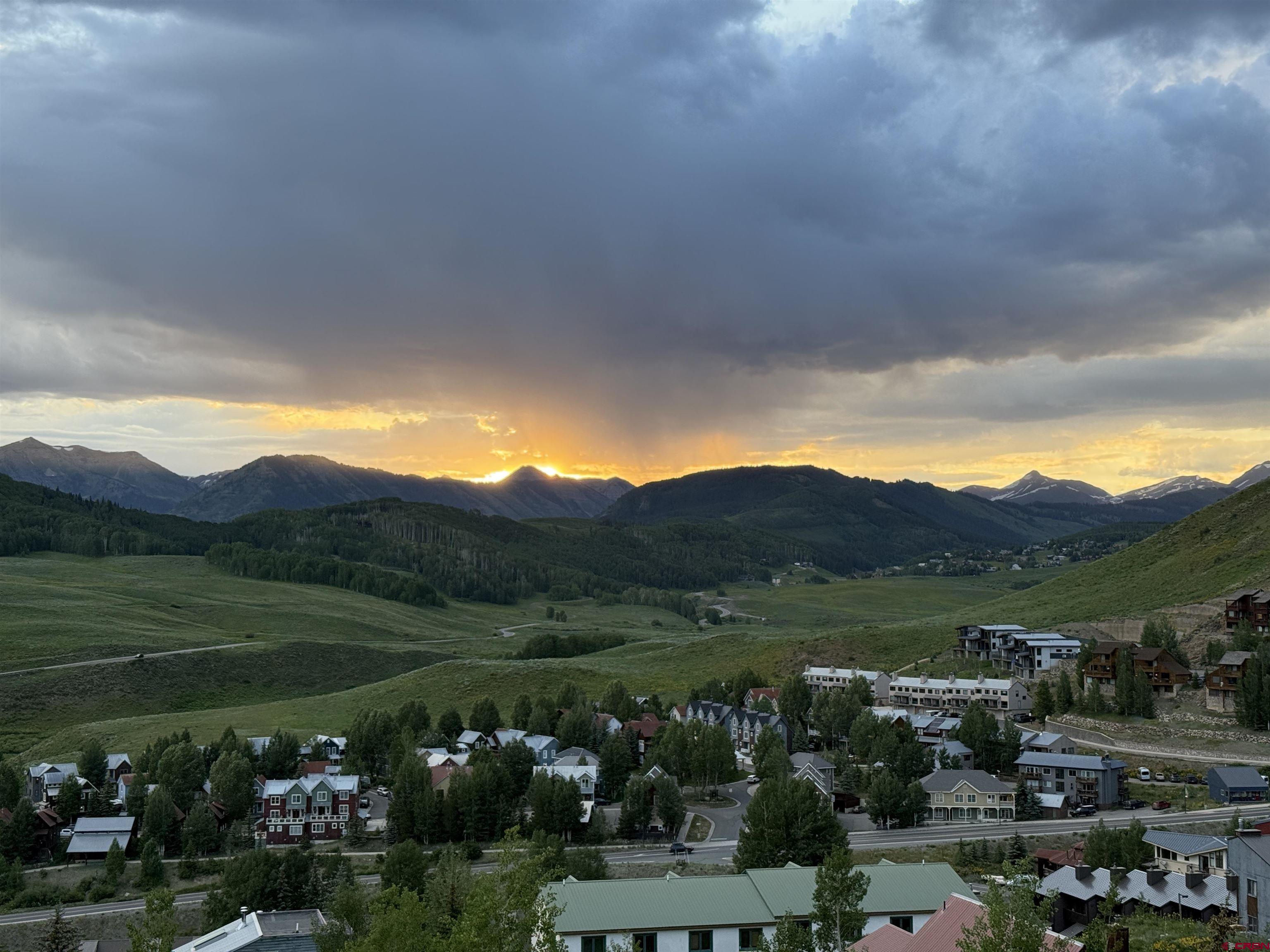 32 Hunter Hill Road, Unit B204 Crested Butte, CO 81225 - Photo 22 of 33 a view of a town with mountains in the background