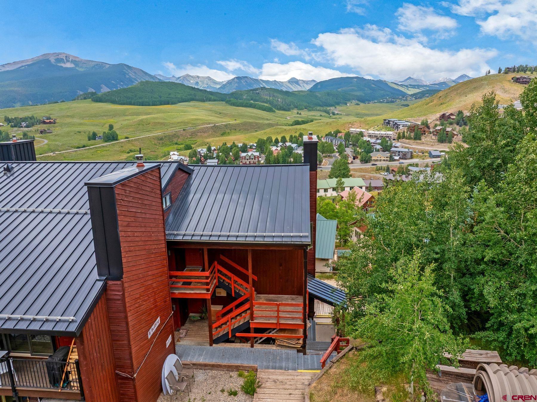 32 Hunter Hill Road, Unit B204 Crested Butte, CO 81225 - Photo 30 of 33 an aerial view of a house with a garden and lake view