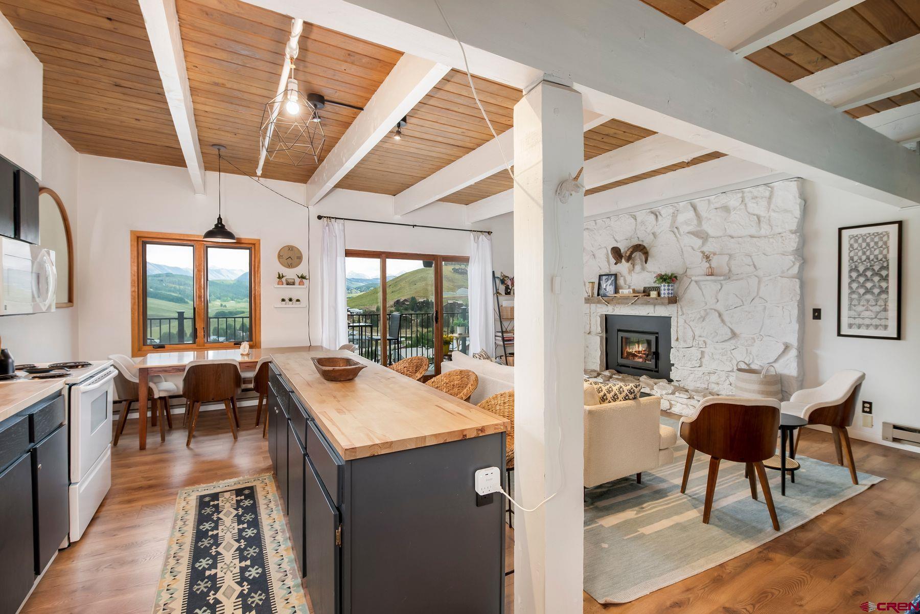 32 Hunter Hill Road, Unit B204 Crested Butte, CO 81225 - Photo 5 of 33 a view of a dining room with furniture window and outside view