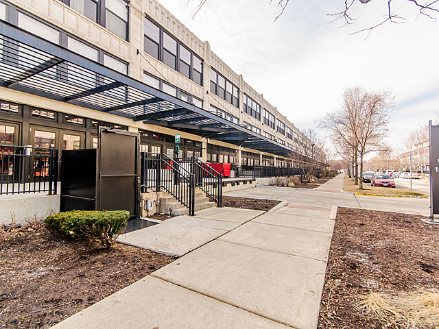1111 West 15th Street, Unit 111 Chicago, IL 60608 - Photo 1 of 17 a view of a building with sitting area