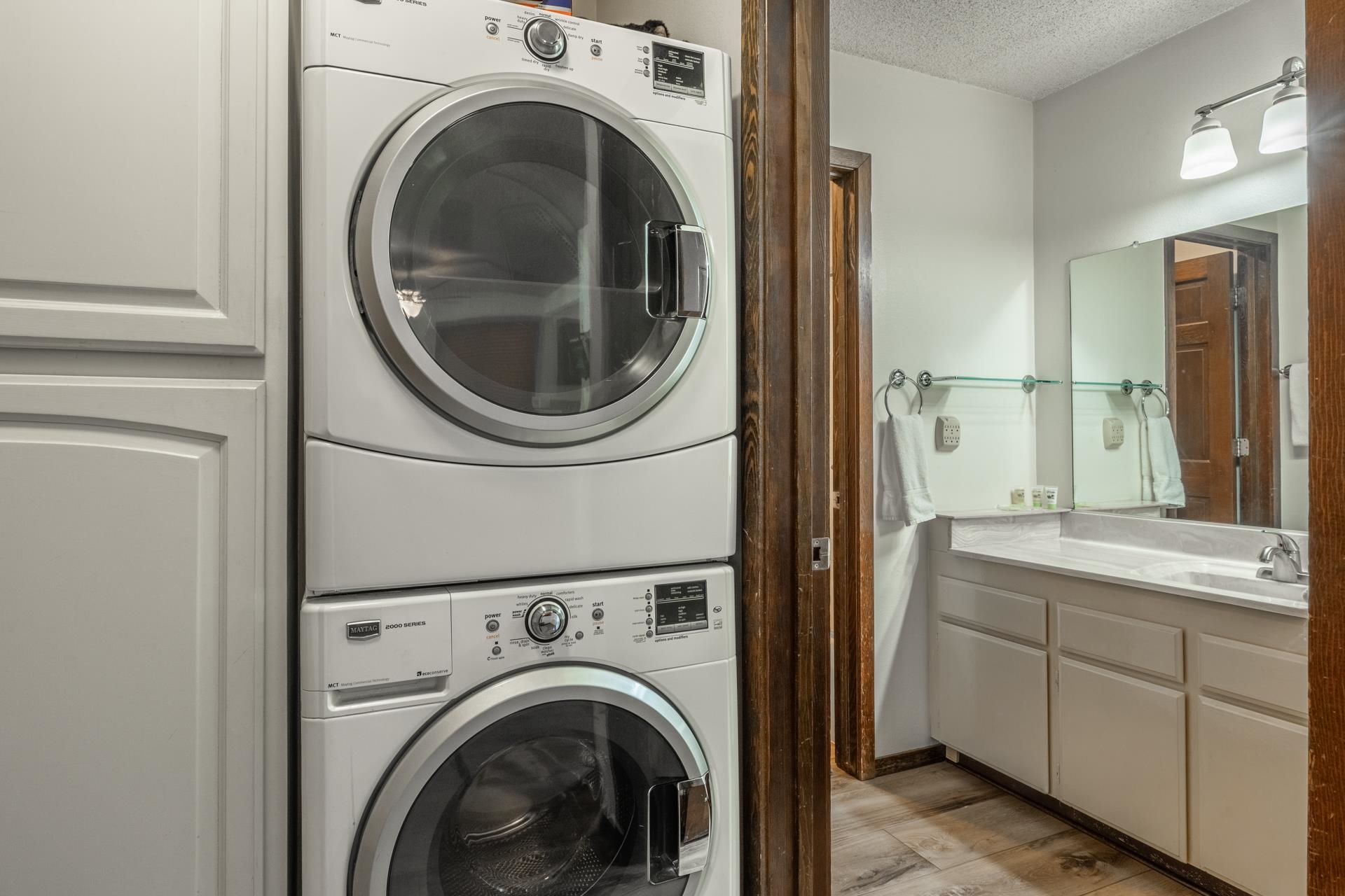 2 Arrowhead Drive, Unit 27 Mammoth Lakes, CA 93546 - Photo 12 of 26 a view of a hallway with washer and dryer