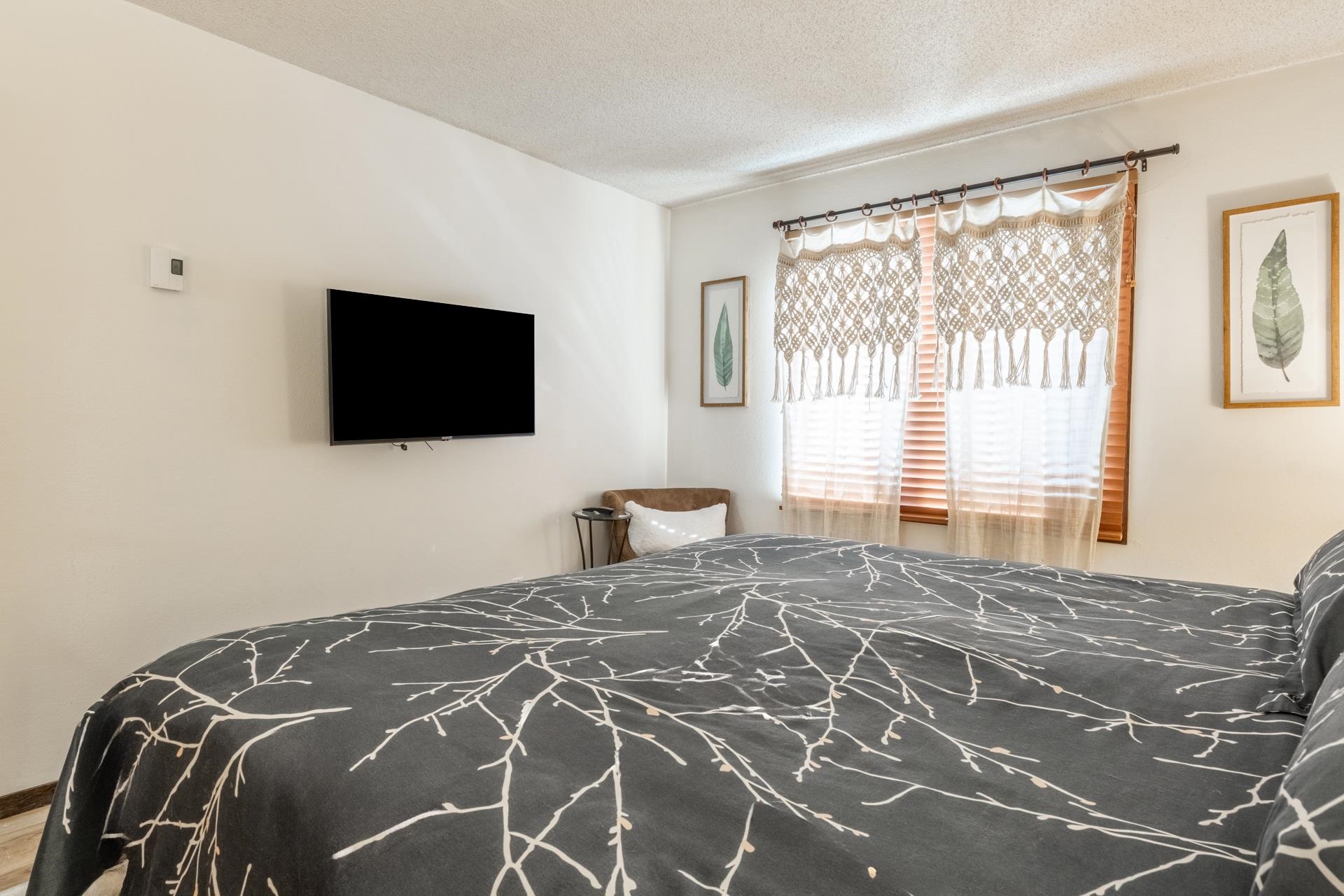 2 Arrowhead Drive, Unit 27 Mammoth Lakes, CA 93546 - Photo 16 of 26 a bedroom with a bed and a flat screen tv