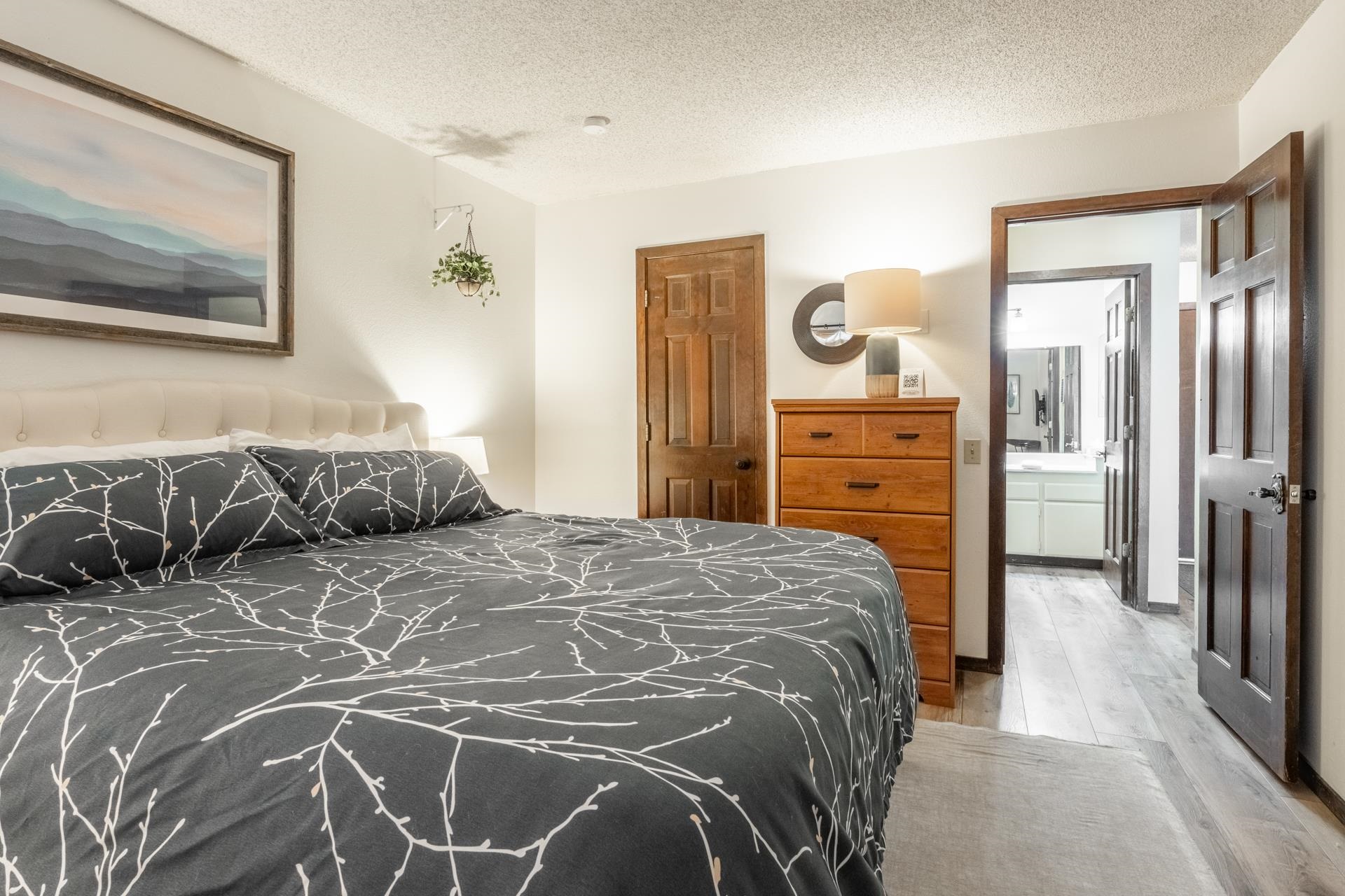 2 Arrowhead Drive, Unit 27 Mammoth Lakes, CA 93546 - Photo 17 of 26 a bedroom with a bed and a dresser