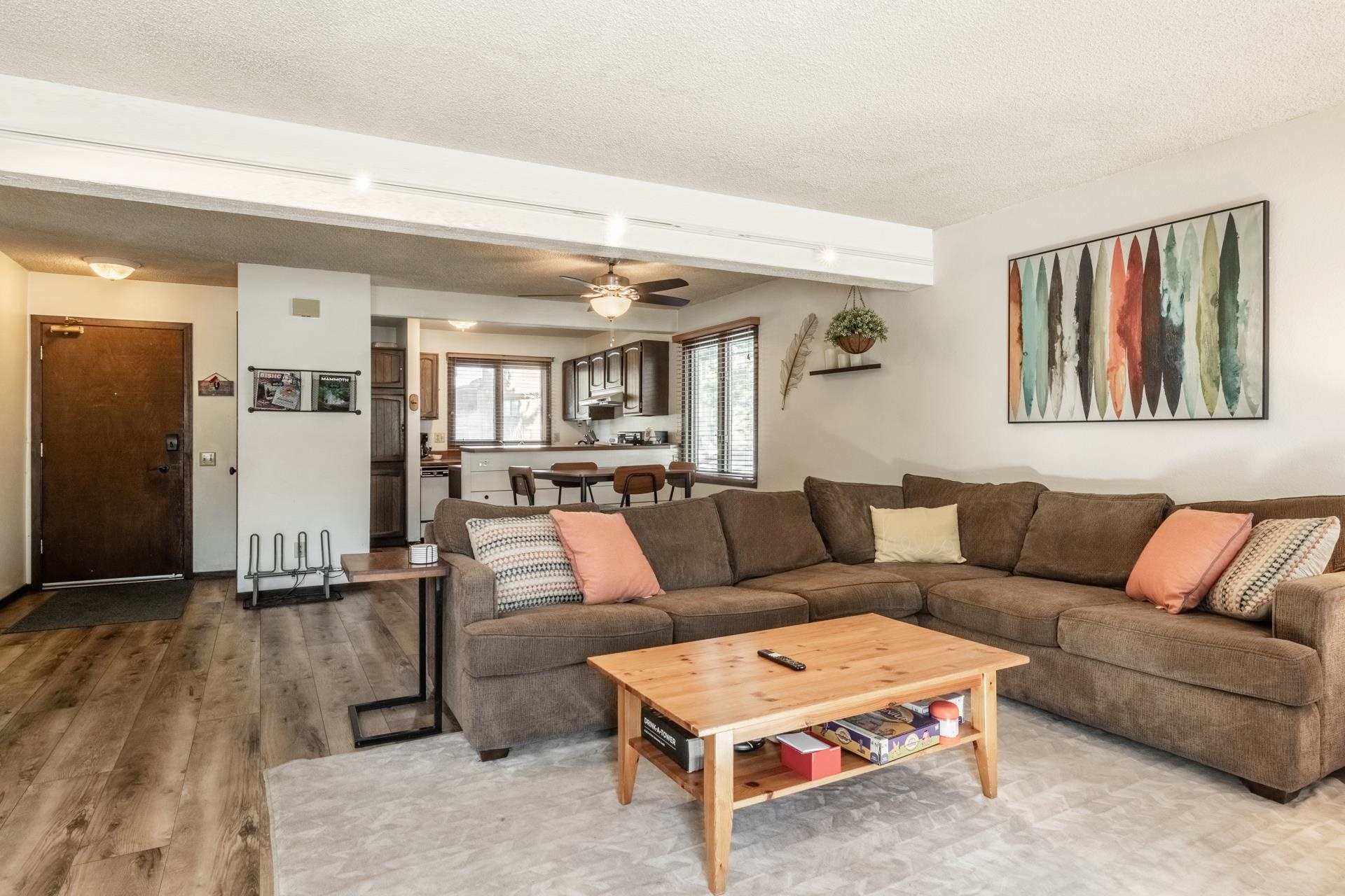 2 Arrowhead Drive, Unit 27 Mammoth Lakes, CA 93546 - Photo 6 of 26 a living room with furniture and a wooden floor