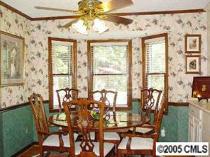 1524 Waterford Place Fort Mill, SC 29708 - Photo 6 of 8 a view of a dining room with furniture and chandelier