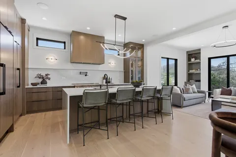 a kitchen with a table and chairs in it