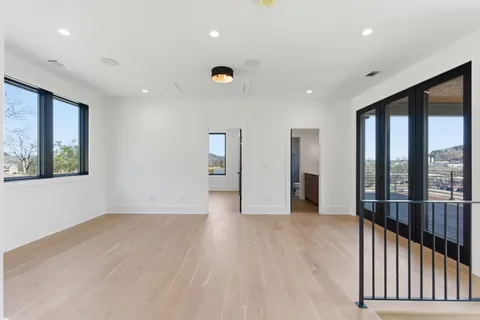 a view of a balcony with wooden floor