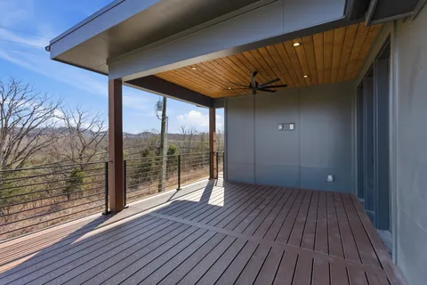 an empty room with windows and cabinet