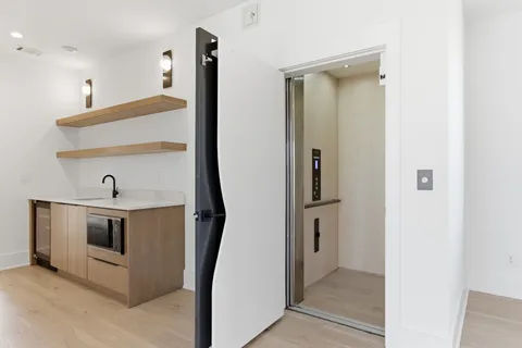 a kitchen with a sink cabinets and stainless steel appliances
