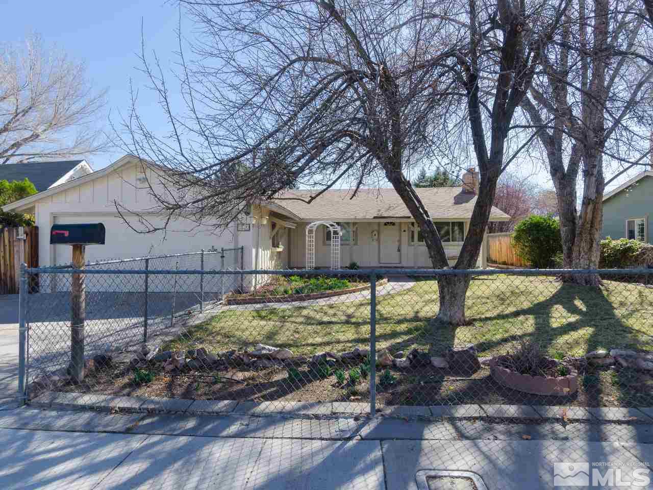4620 Azalea Drive Reno, NV 89502 - Photo 1 of 19 a view of a yard with large tree