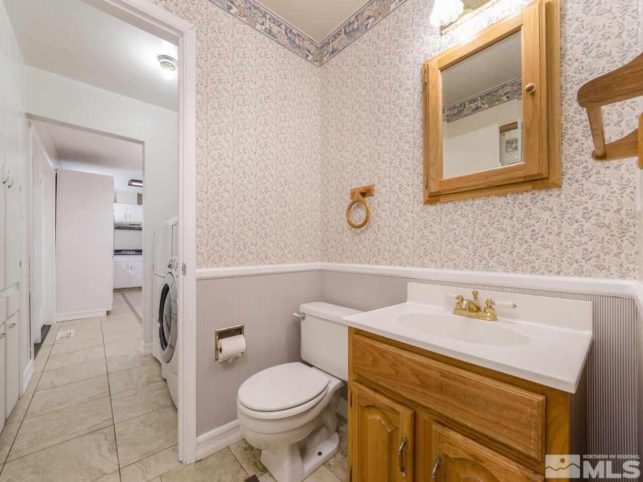 4620 Azalea Drive Reno, NV 89502 - Photo 11 of 19 a bathroom with a sink a toilet and a mirror
