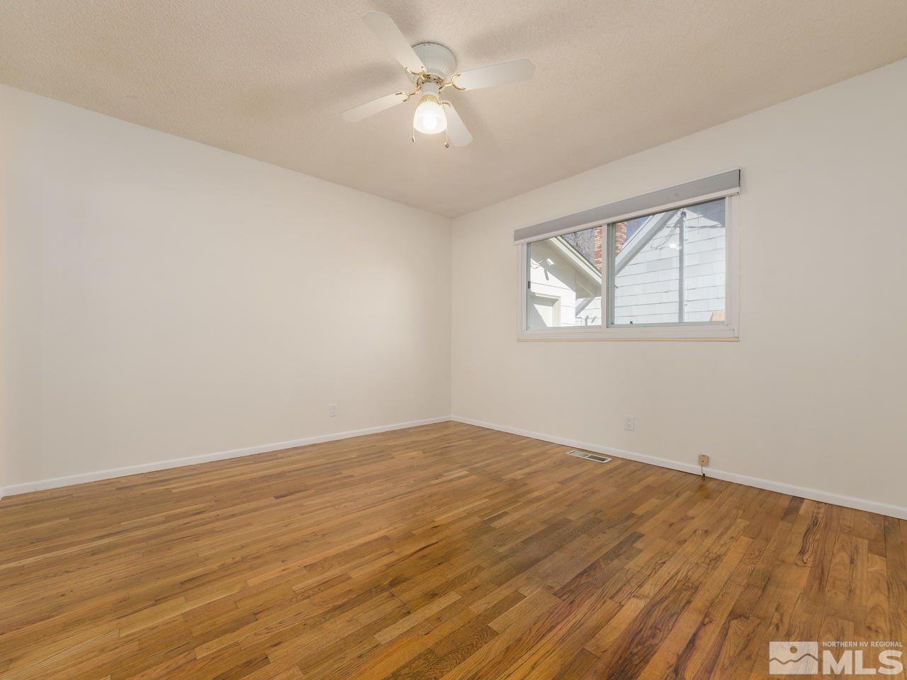 4620 Azalea Drive Reno, NV 89502 - Photo 12 of 19 wooden floor in an empty room with a window