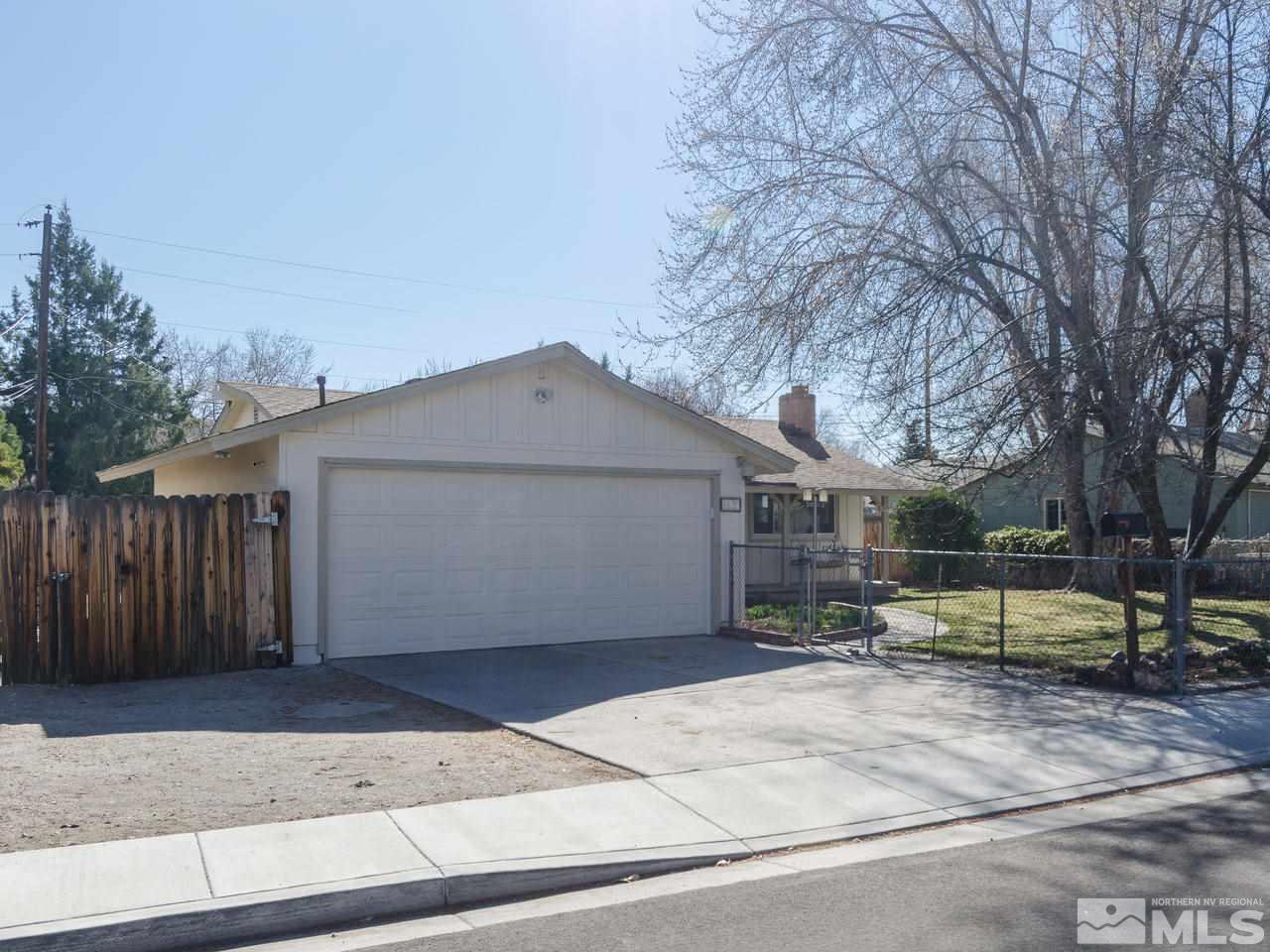 4620 Azalea Drive Reno, NV 89502 - Photo 3 of 19 a view of a white house with a large tree