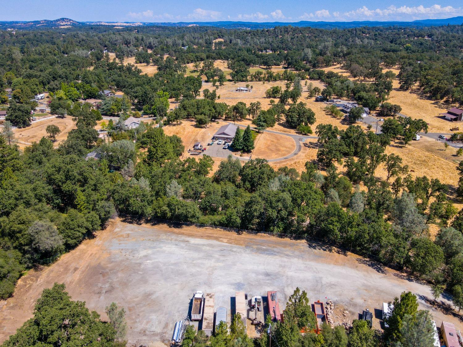 6069 Pleasant Valley Road El Dorado, CA 95623 - Photo 7 of 10 an aerial view of a houses with a yard and mountain view