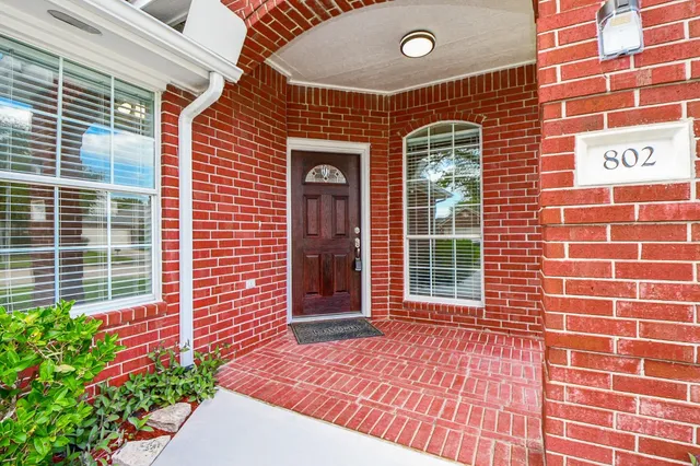 a view of a brick building with a door
