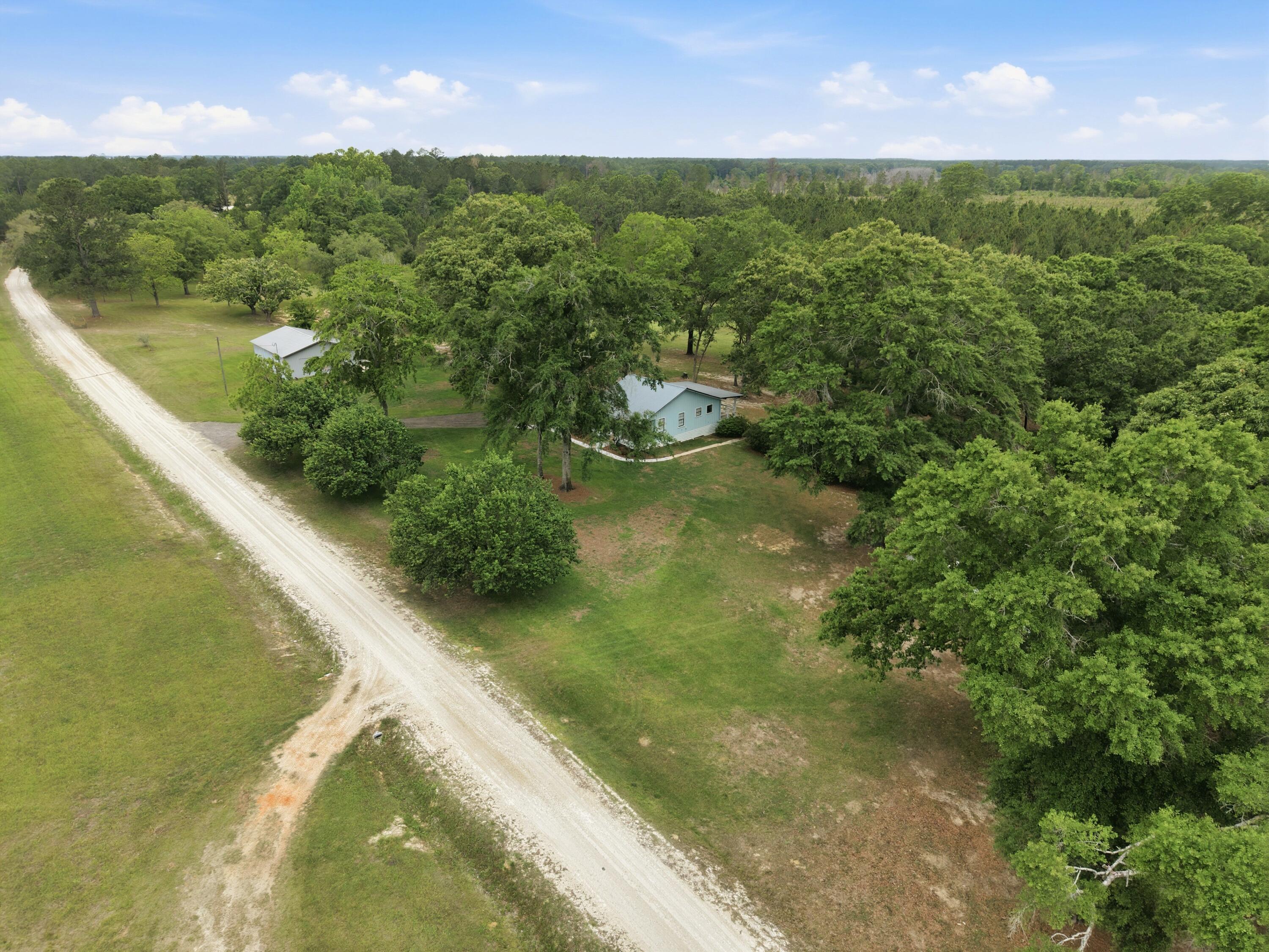 261 Wilkerson Road DeFuniak Springs, FL 32433 - Photo 35 of 76 a view of a lake from a yard