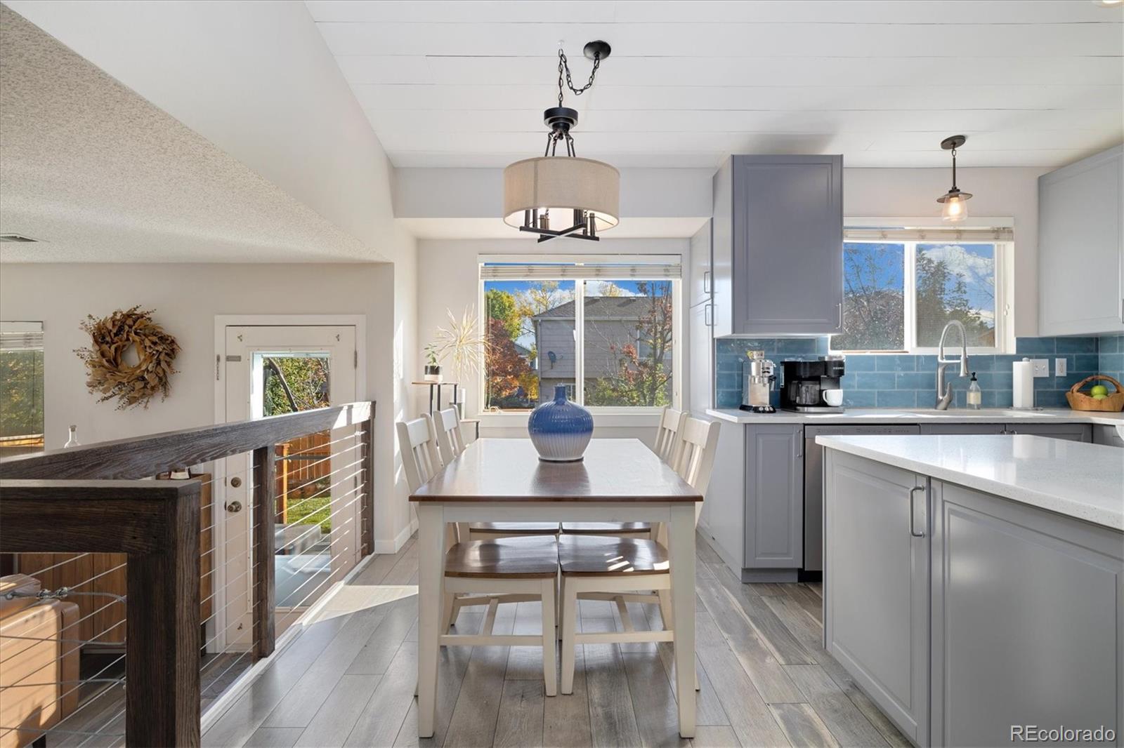 9823 South Castle Ridge Circle Highlands Ranch, CO 80129 - Photo 13 of 46 a kitchen with a table and chairs in it