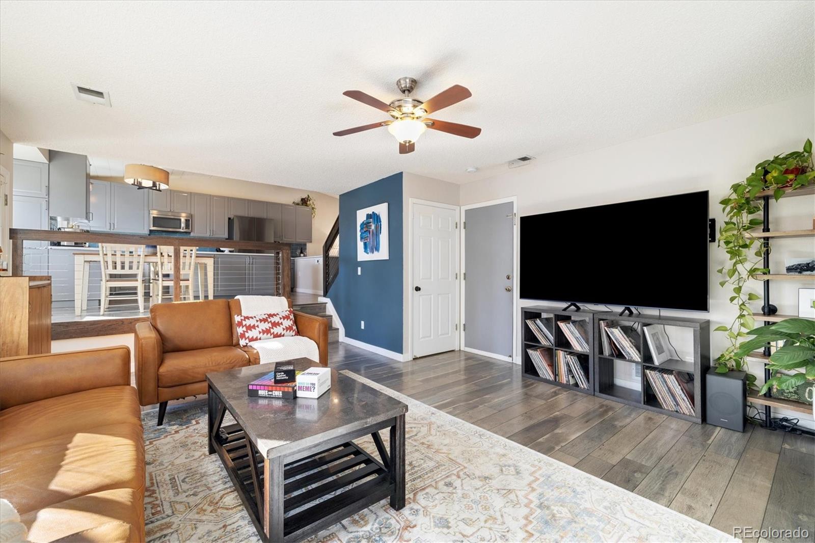 9823 South Castle Ridge Circle Highlands Ranch, CO 80129 - Photo 18 of 46 a living room with furniture and a flat screen tv