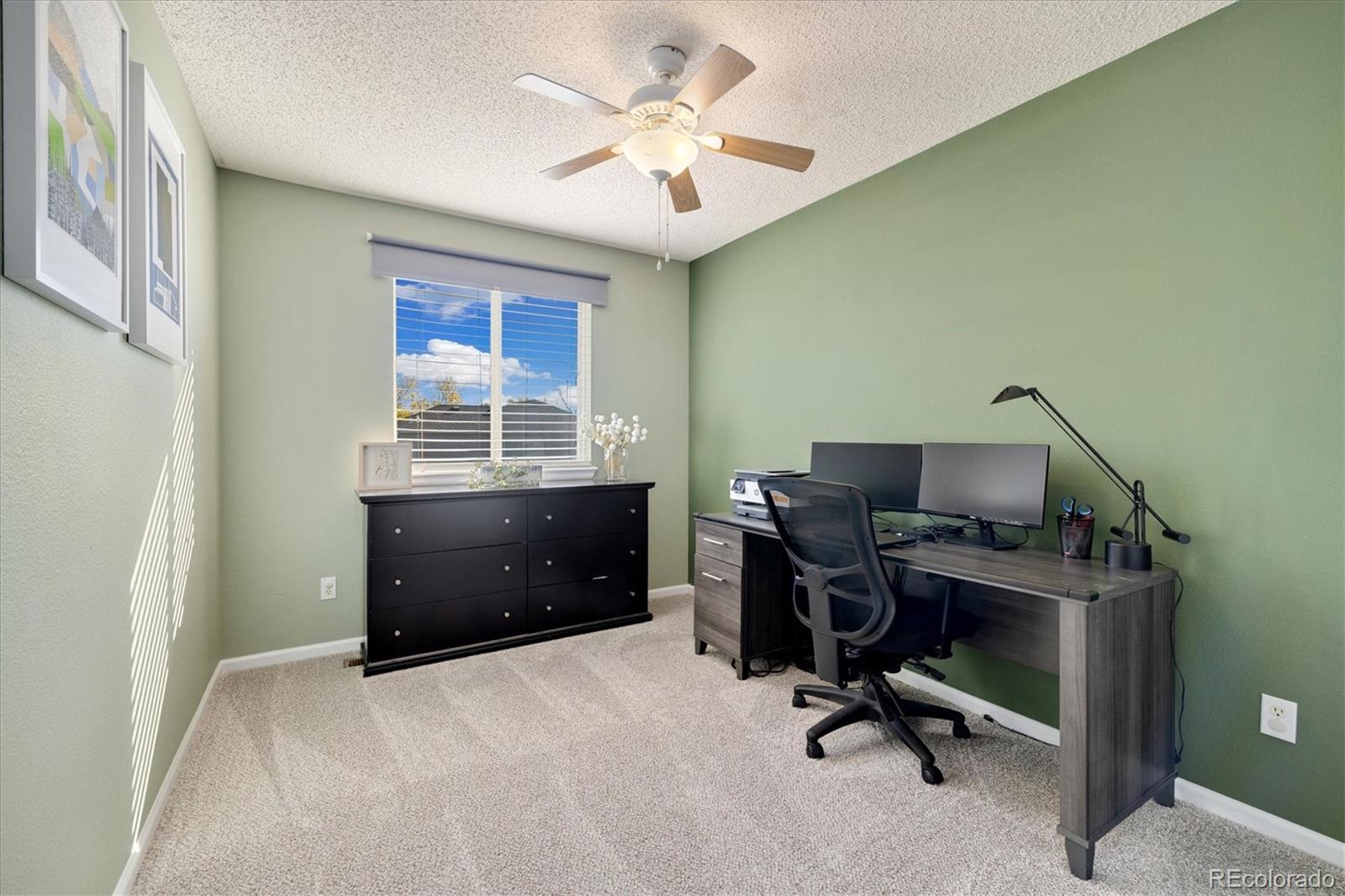 9823 South Castle Ridge Circle Highlands Ranch, CO 80129 - Photo 26 of 46 a workspace with furniture and a window