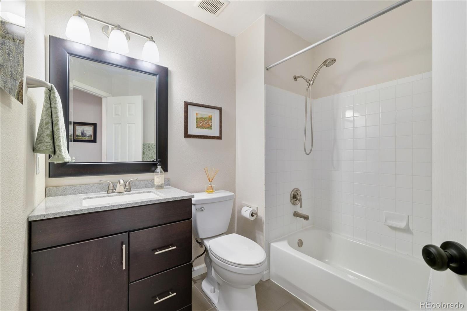 9823 South Castle Ridge Circle Highlands Ranch, CO 80129 - Photo 27 of 46 a bathroom with a sink toilet tub and shower