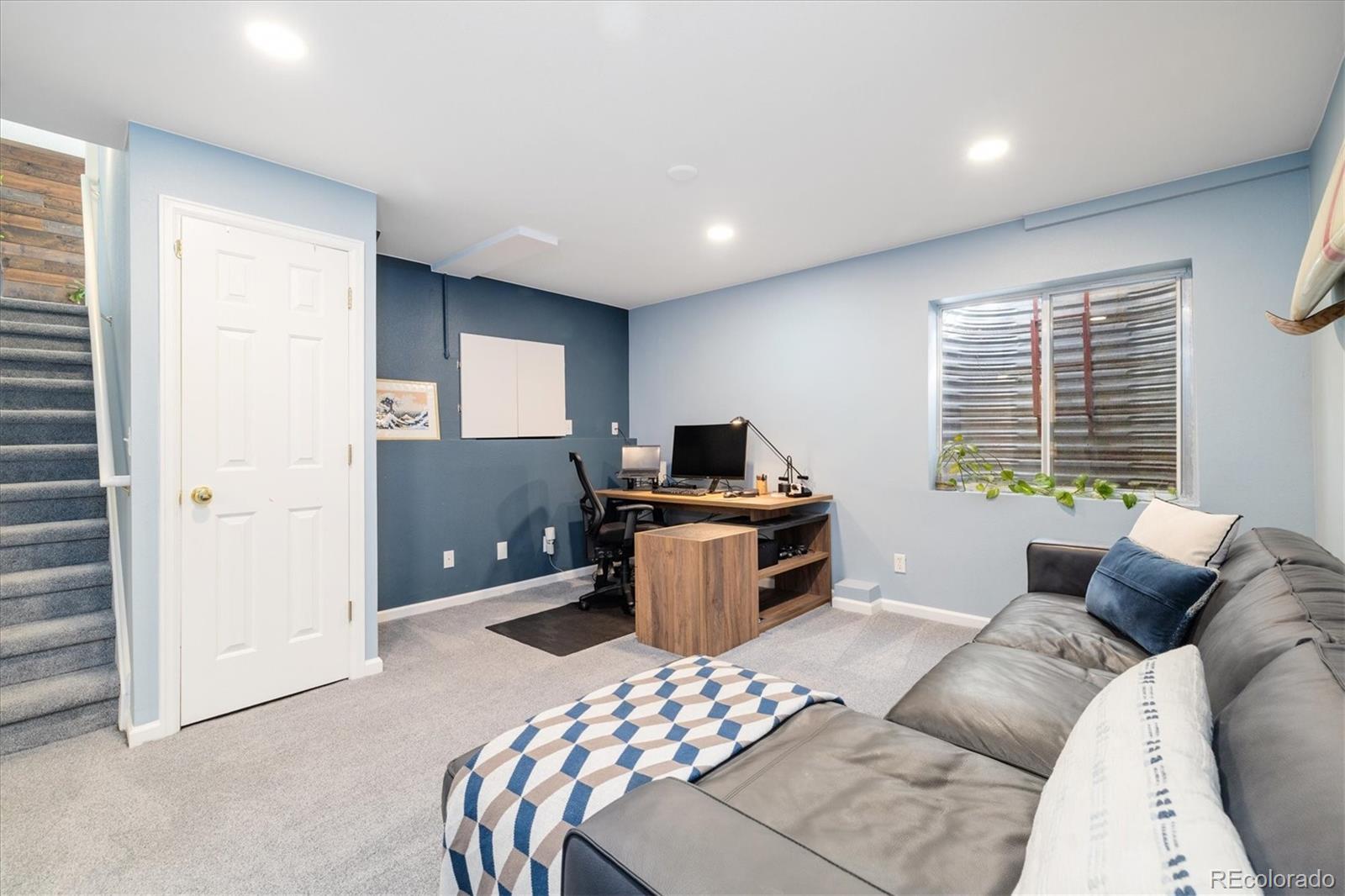 9823 South Castle Ridge Circle Highlands Ranch, CO 80129 - Photo 28 of 46 a bedroom with a bed and a television