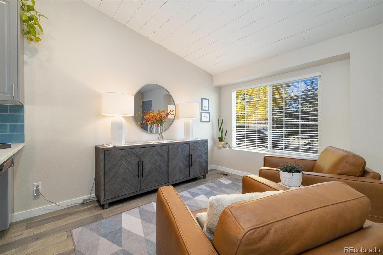 9823 South Castle Ridge Circle Highlands Ranch, CO 80129 - Photo 5 of 46 a living room with furniture and a window