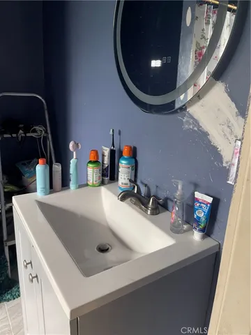 a bathroom with a toilet and a shower curtain