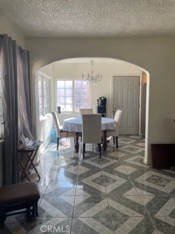 a kitchen with stainless steel appliances granite countertop a refrigerator stove and sink