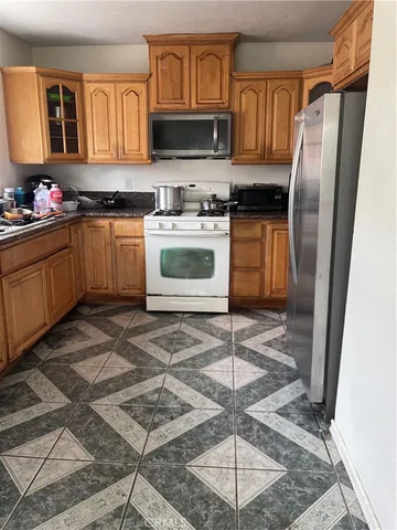 a view of a workspace with furniture and a chair