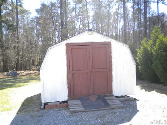 115 Forest Ridge Drive Willow Spring, NC 27592 - Photo 16 of 17 a view of backyard with tub
